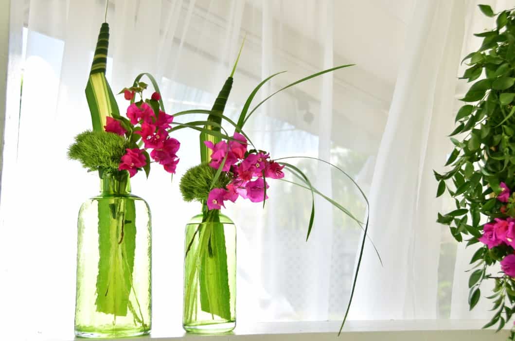 chic girly floral arrangement using vintage jars - beautiful and tripical