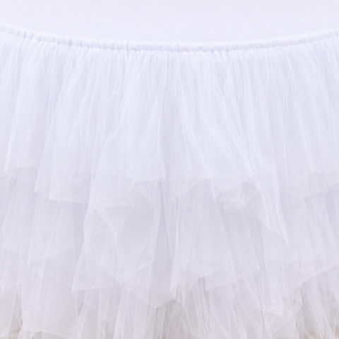 TABLECLOTH WHITE TULLE SKIRTING ROUND 4ftL CELEBRATIONS GRAND CAYMAN RENTAL PARTY EVENTS CUSHION SILVER SATIN 20IN X 20INCUSHION ORANGE GEOMETRIC DESIGN 18IN X 18INTABLECLOTH WHITE TULLE SKIRTING ROUND 4ftL
